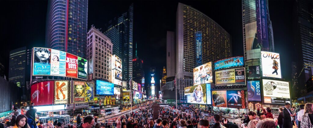 NEW YORK - CIRCA OCT, 2014: Night traffic across Times square in New York City in a panoramic 180Â° view. Times Square is the most visited tourist attraction in the world.