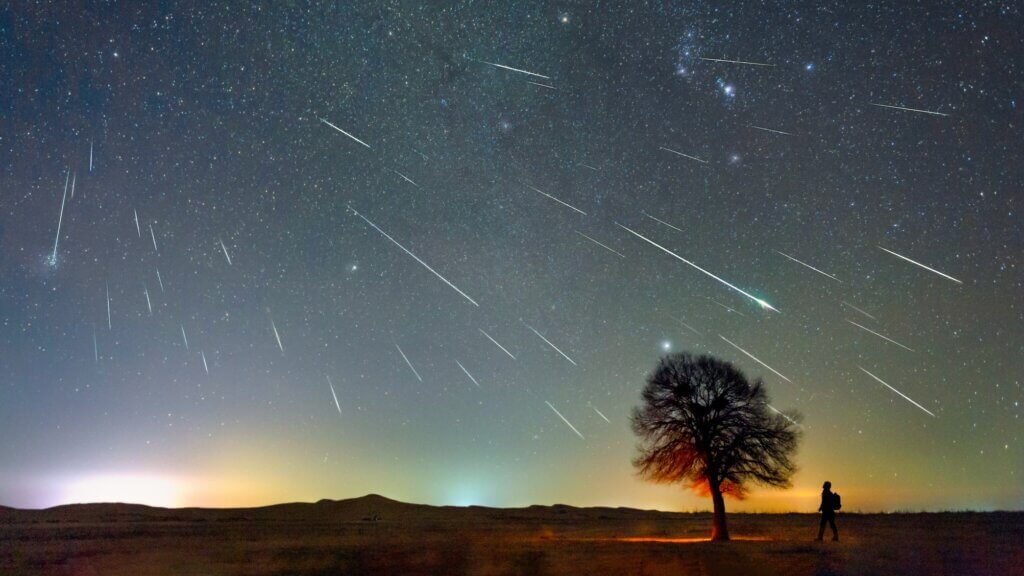 The Geminid meteor shower on December 13, 2020 was photographed in the Kubuqi Desert of Inner Mongolia, China, on a very cold night of minus 20 degrees